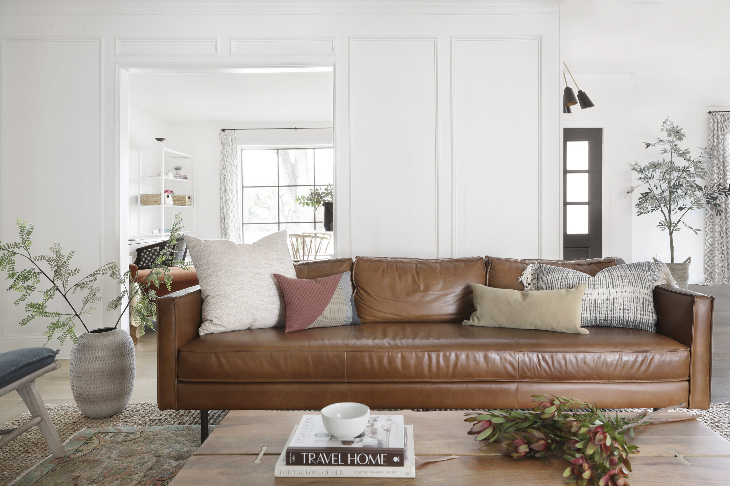Leather Sofa // White Pillow // Colorblock Pillow // Suede Lumbar // Fringed Pillow (similar) // Coffee Table